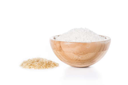 White rice flour in a bowl isolated on white backgroundの写真素材