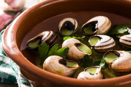 Escargots de Bourgogne. Snails with herbs and garlic butter. Close up