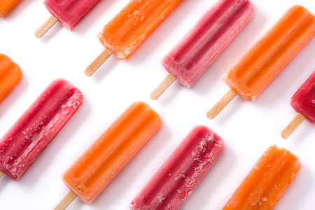 Orange and strawberry  ice lolly i pattern isolated on white background.