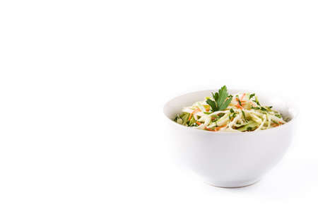 Coleslaw salad in white bowl isolated on white background. Copyspace