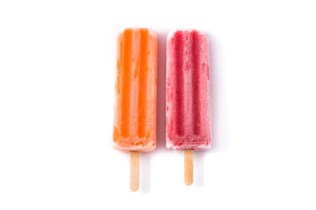 Orange and strawberry ice lolly isolated on white background .. Top view.の写真素材