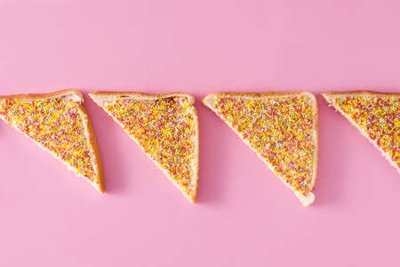 Traditional Australian fairy bread on pink backgroundの写真素材