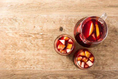 Red wine sangria in glass on wooden table. Top view. Copyspaceの写真素材
