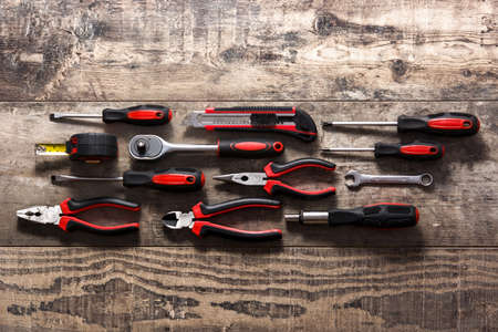 Building tools set on wooden table. Top view