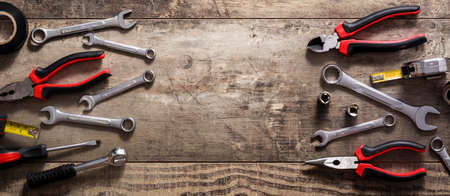 Building tools set on wooden table. Top view. Panoramic view. Copyspaceの写真素材