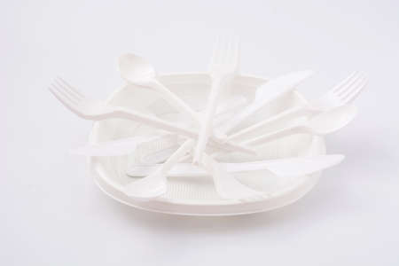 Disposable plastic crockery isolated on white background