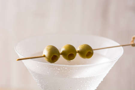 Classic Dry Martini with olives on gray background. Close upの写真素材