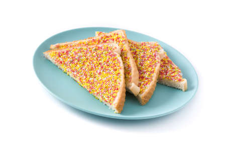 Traditional Australian fairy bread on plate isolated on white background.の写真素材