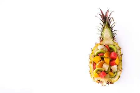 Mix fruit served inside pineapple isolated on white background. Top viewの写真素材