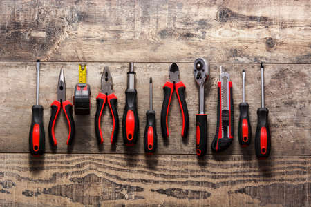 Building tools repair set on wooden tableの写真素材