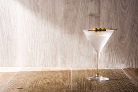 Classic Dry Martini with olives on gray backgroundの写真素材