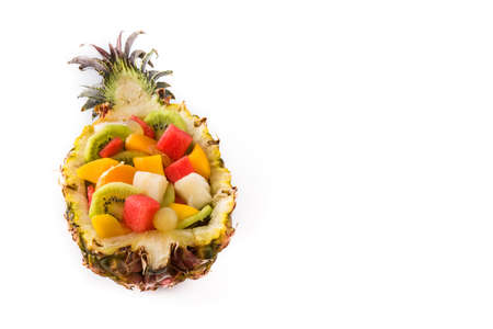 Mix fruit served inside pineapple isolated on white backgroundの写真素材
