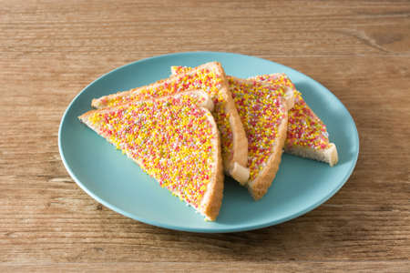 Traditional Australian fairy bread on wooden tableの写真素材