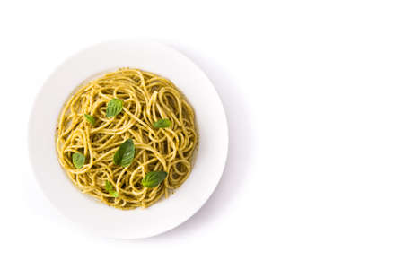 Spaghetti pasta with pesto sauce isolated on white background.Top view. Copy spaceの写真素材