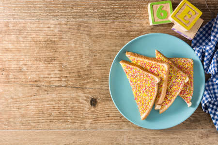 Traditional Australian fairy bread on wooden tableの写真素材