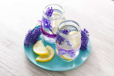 Lavender lemonade drink in jar on wooden tableの写真素材