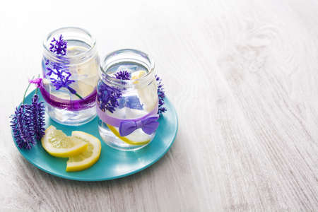 Lavender lemonade drink in jar on wooden tableの写真素材
