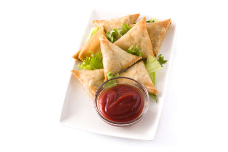Samsa or samosas with meat and vegetables isolated on white background. Traditional Indian food.