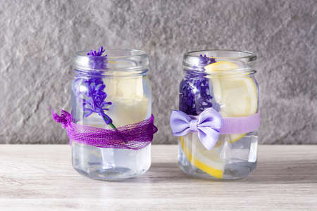 Lavender lemonade drink on white wooden tableの写真素材