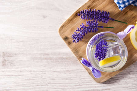 Lavender lemonade drink on white wooden table. Top view. Copyspaceの写真素材