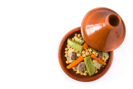 Traditional tajine with vegetables, chickpeas, meat and couscous isolated on white background. Top view. Copyspaceの写真素材