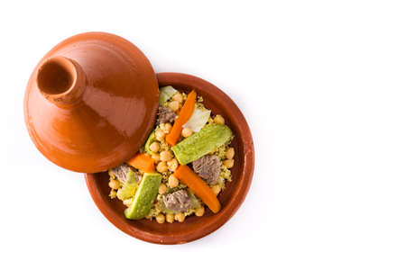 Traditional tajine with vegetables, chickpeas, meat and couscous isolated on white background. Top view. Copyspaceの写真素材