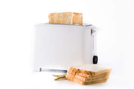 Toasted toast bread in white toaster isolated on white background