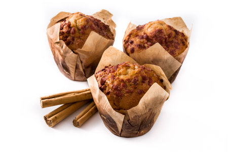 Apples and cinnamon muffins isolated on white backgroundの写真素材