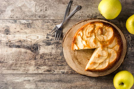 Homemade apple pie slice on wooden table. Top view. Copy spaceの写真素材