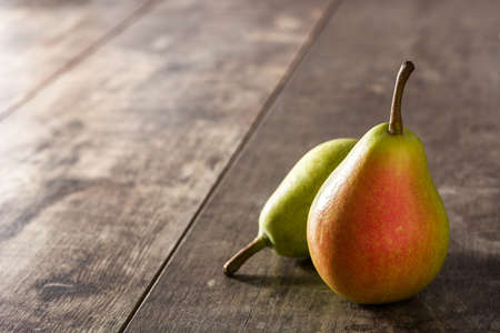 Two pears on wooden table. Copy spaceの写真素材