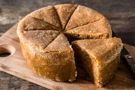 Traditional Christmas marzipan on wooden table.の写真素材