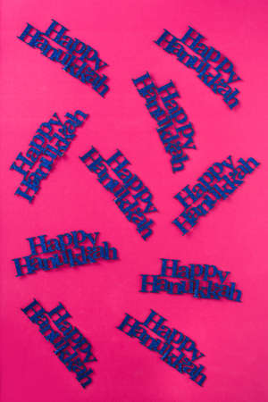 Happy Hanukkah words pattern on pink backgroundの写真素材