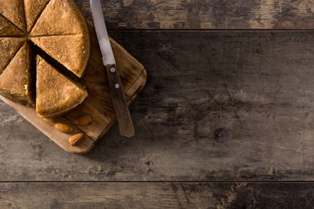 Traditional marzipan slice on wooden table top view copy spaceの写真素材