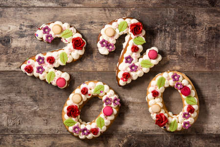 2020 cake on wooden table. New year concept.
