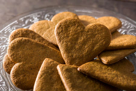 Heart shaped cookie on wooden table. Valentine's Day and Mother's Day concept.の写真素材