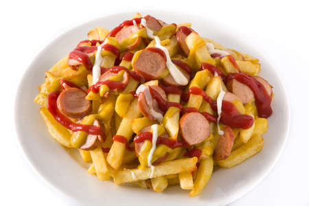 Typical Latin America Salchipapa. Sausages with fries, ketchup, mustard and mayo, isolated on white backgroundの写真素材