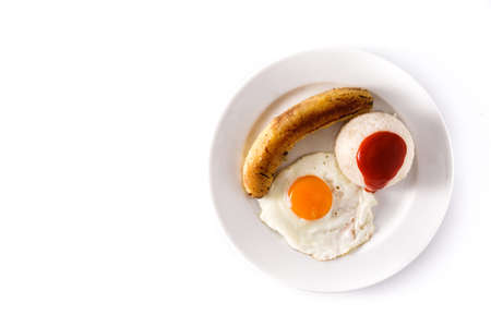 Cuban rice.Typical Cuban rice with fried banana and fried egg on a plate isolated on white background. Top view Copy spaceの写真素材