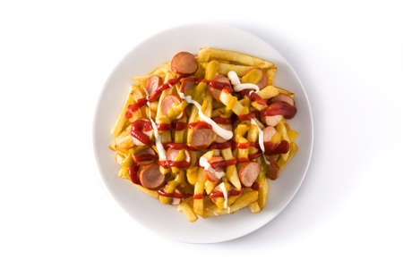 Typical Latin America Salchipapa. Sausages with fries, ketchup, mustard and mayo isolated on white...
