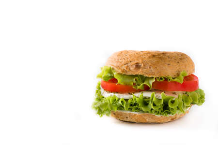 Vegetable bagel sandwich with tomato, lettuce, and mozzarella cheese isolated on white background. Copy spaceの写真素材