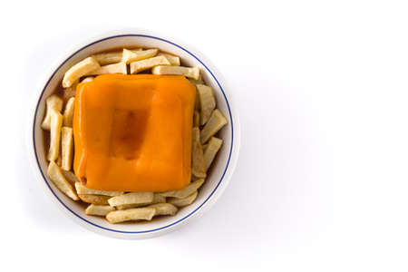 Typical Portuguese francesinha sandwich with french fries isolated on white background. Top view...