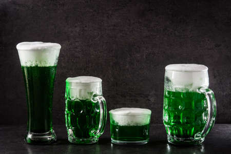 Traditional St Patrick's Day green beers on black background.の写真素材