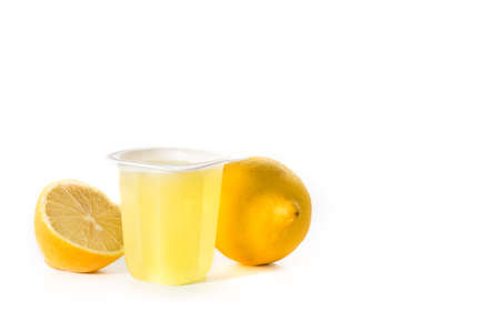 Lemon jellies on a plastic cup isolated on white background. Copy spaceの写真素材