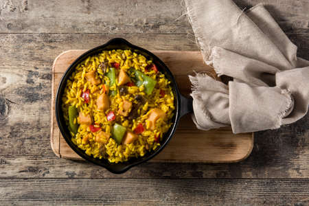 Fried rice with chicken and vegetables on frying iron panの写真素材