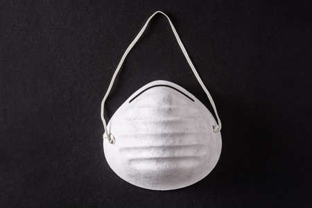 Medical face mask on black backgroundの写真素材