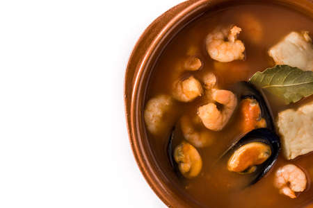 French bouillabaisse soup in bowl isolated on white background.