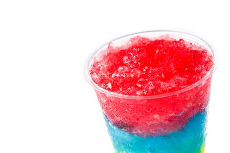 Colorful slushie of differents flavors with straw in plastic cup isolated on white backgroundの写真素材