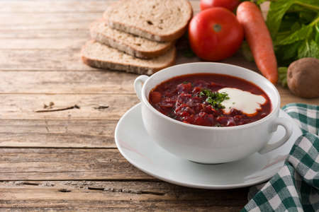 Traditional Ukrainian Russian borsch. Beetroot soup on wooden tableの写真素材