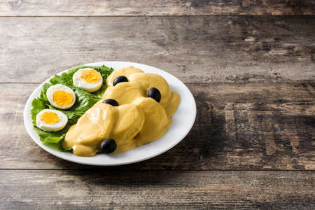 Traditional Peruvian papa a la huancaina on wooden tableの写真素材
