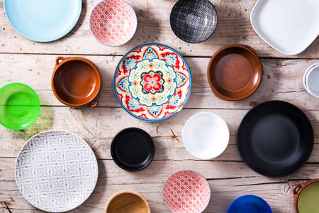 Set of different empty bowls on wooden backgroundの写真素材