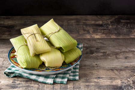 Assortment of ingredients on puffed rice cakes on wooden tableの写真素材